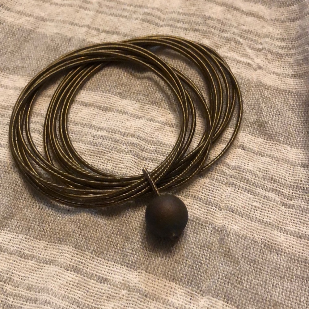 Piano wire bracelet with bead